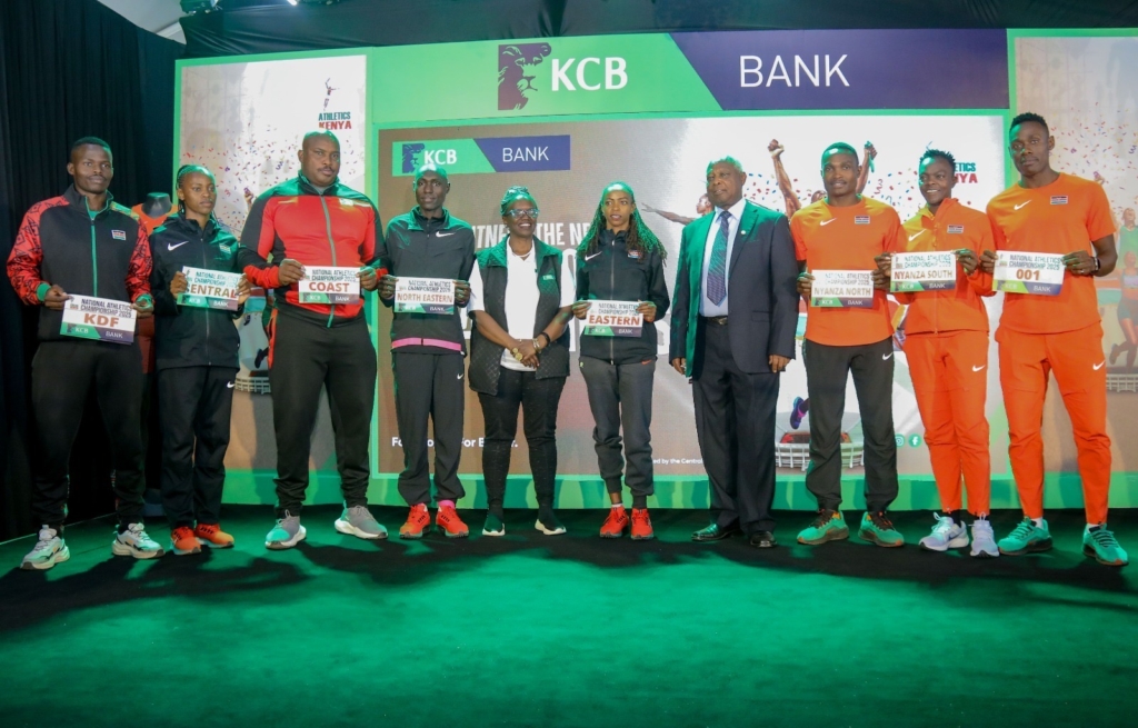 KCB Foundation Director Mendi Njonjo (Centre) and Athletics Kenya President Lt. Gen (Rtd) Jackson Tuwei pose for a photo with athletes during the KCB Athletics Kenya sponsorship unveiling ceremony at the heart of Kencom, Nairobi on June 24, 2025.