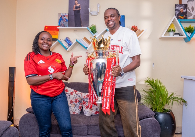 Man United fan Ann Njoroge hosts the Premier League Trophy and former Arsenal player Nwankwo Kanu at her home Man United fan Ann Njoroge hosts the Premier League Trophy and former Arsenal player Nwankwo Kanu at her home