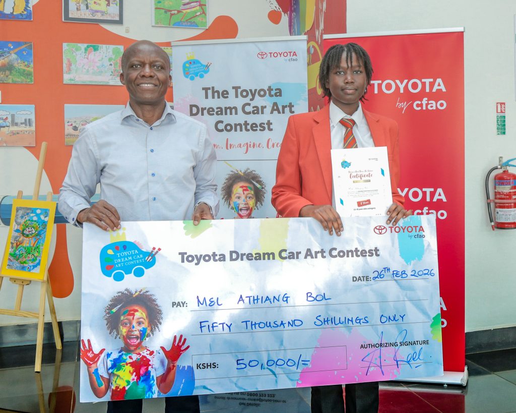 Joshua Anya (DMD, CFAO Mobility Kenya) and Mel Athiang Bol (National Winner, Under-15 Category) during the official prize handover for the Toyota Dream Car Art Contest.